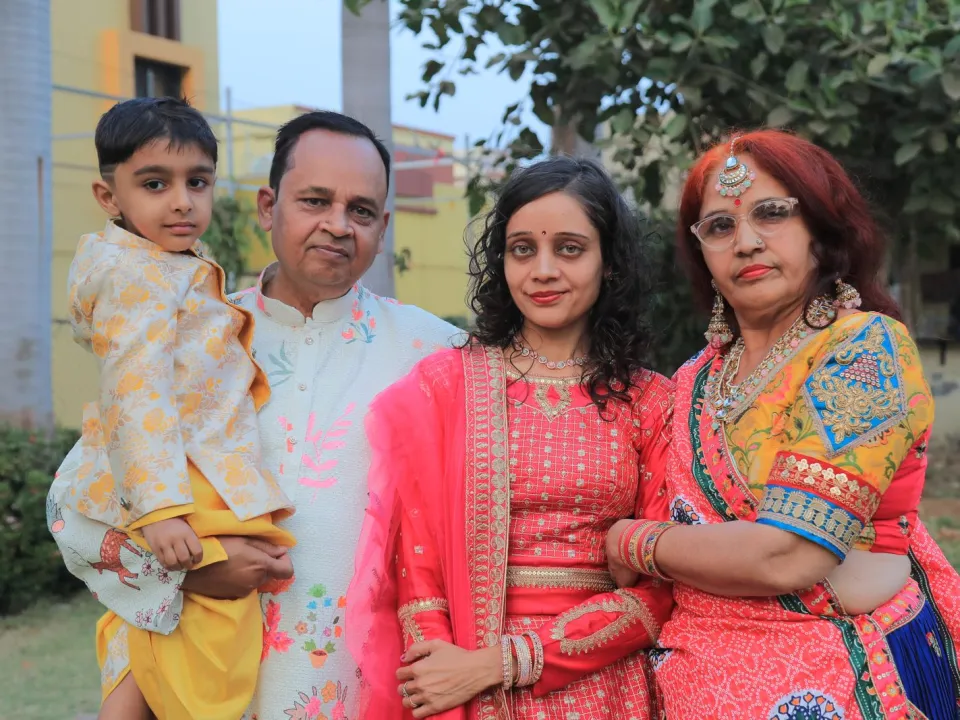 A Gujarati family in traditional Navratri clothes, three generations together
