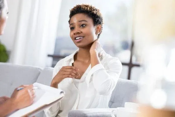 A woman talking openly with her counselor
