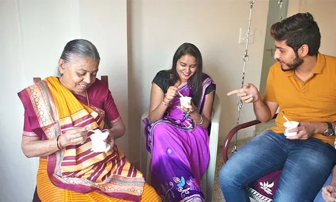 A newly married woman sharing a light moment with her family at home