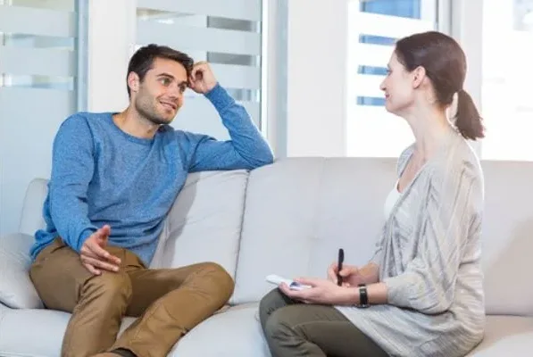 A man talking openly with a counselor